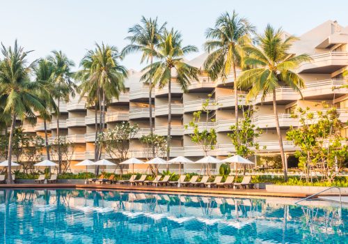 Beautiful luxury outdoor swimming pool with umbrella and chair in hotel pool resort - Vintage light Filter